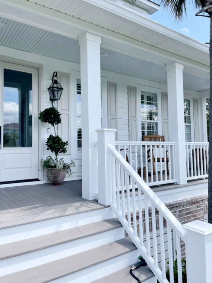 Composite porch decking with railings and clean finished fascia