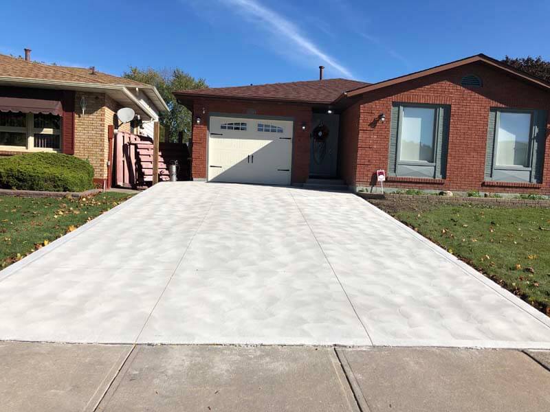 Smooth finish concrete driveway with a clean broom-free surface