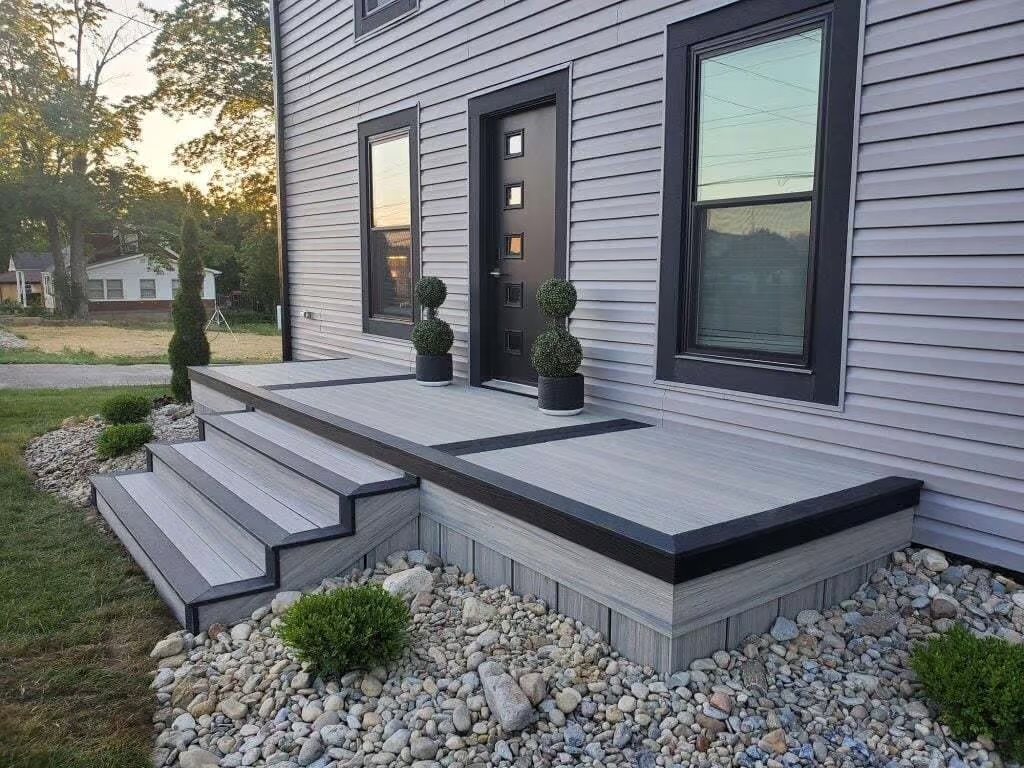 Composite porch and steps with contrasting dark border boards